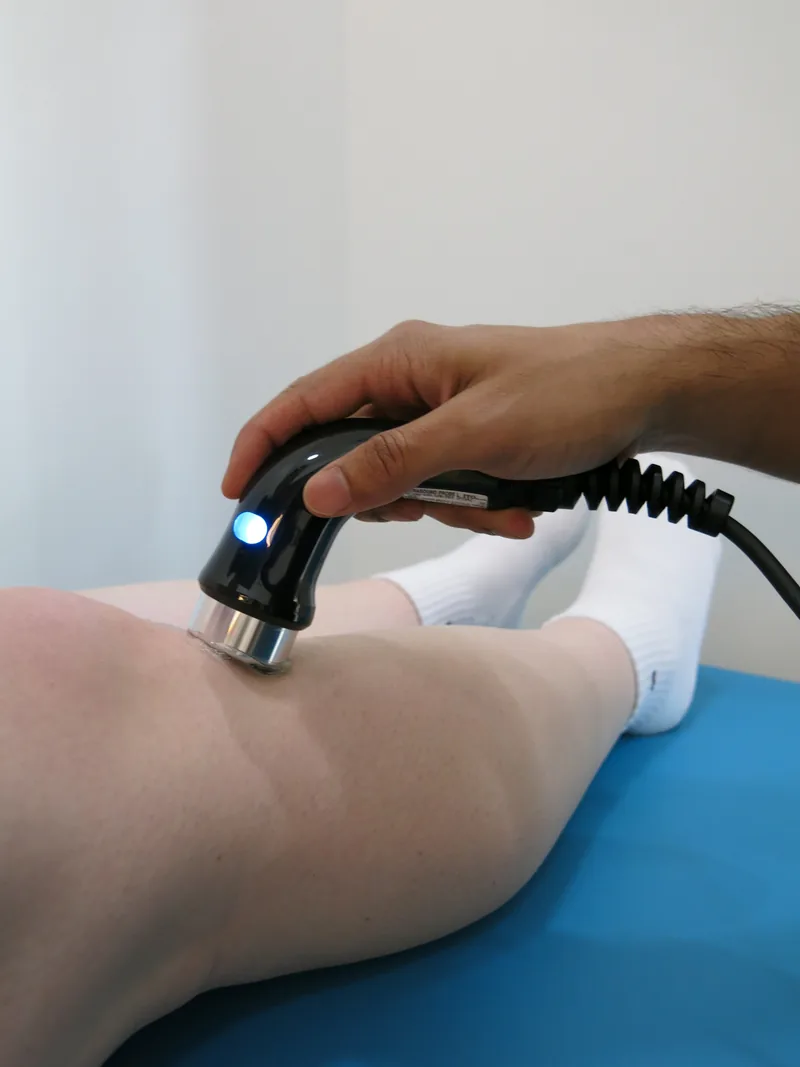 Physiotherapy treatment on a patient's knee at Interlink Physiotherapy in Ancaster